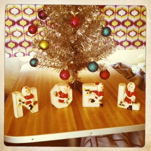 My mom gave me this 1961 Noel set for Christmas.  It's the same age as Junebug, so of course it had to go inside on her table! 