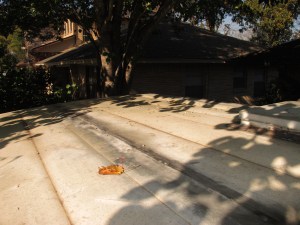 The roof is in pretty poor condition at the moment.  Needs to be resealed and screwed back down to the frame.  I'm hoping it's not that way because the frame is rotted.  I'll find out soon!
